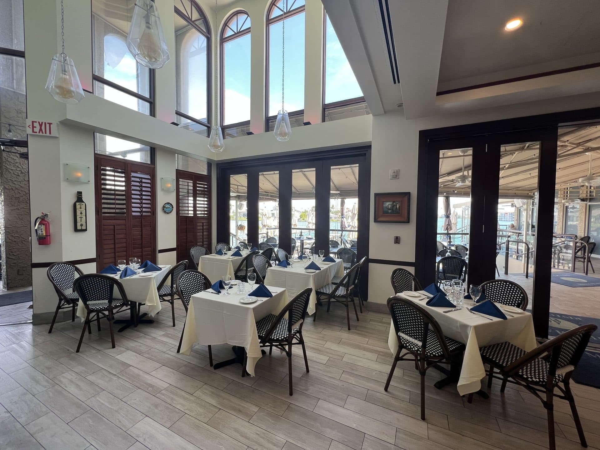 Waterfront dining at dusk on Venetian Bay, Naples